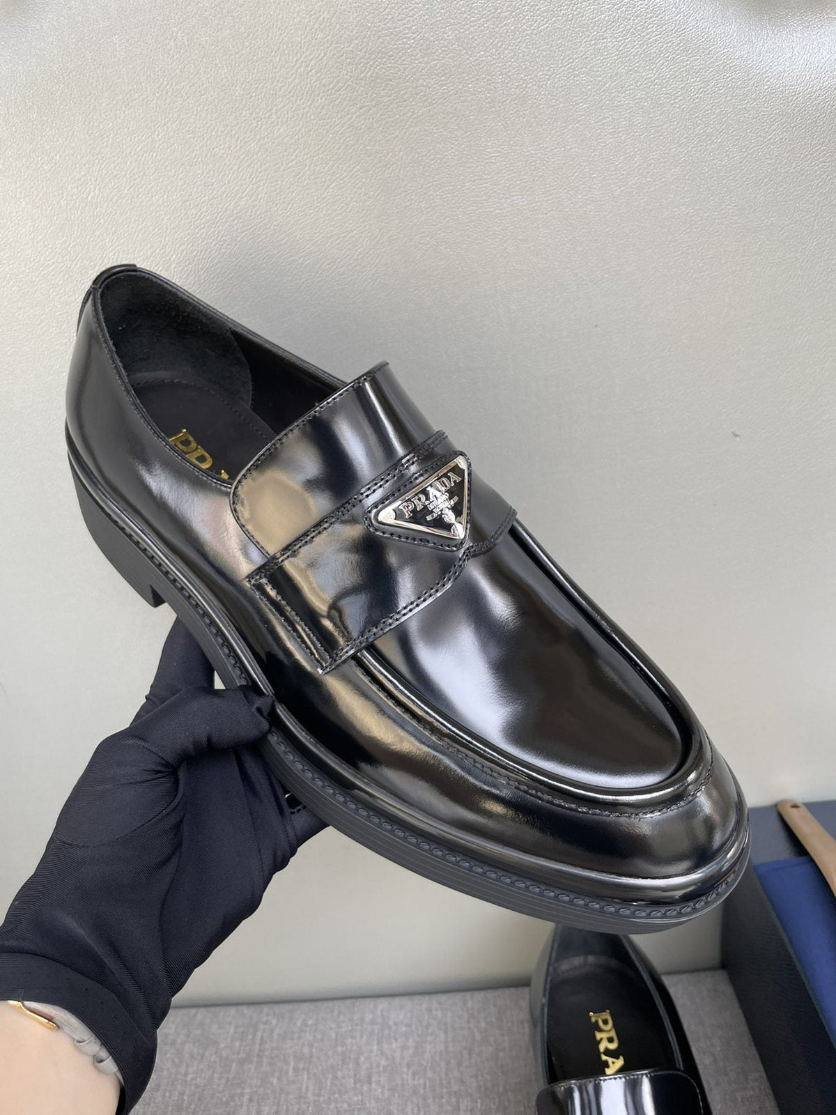 PRADA Black Glossy Plaque Loafers — model