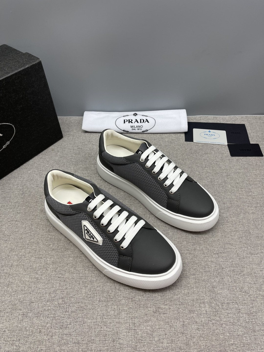 Prada Triangle Patch Low-Top Sneakers — front