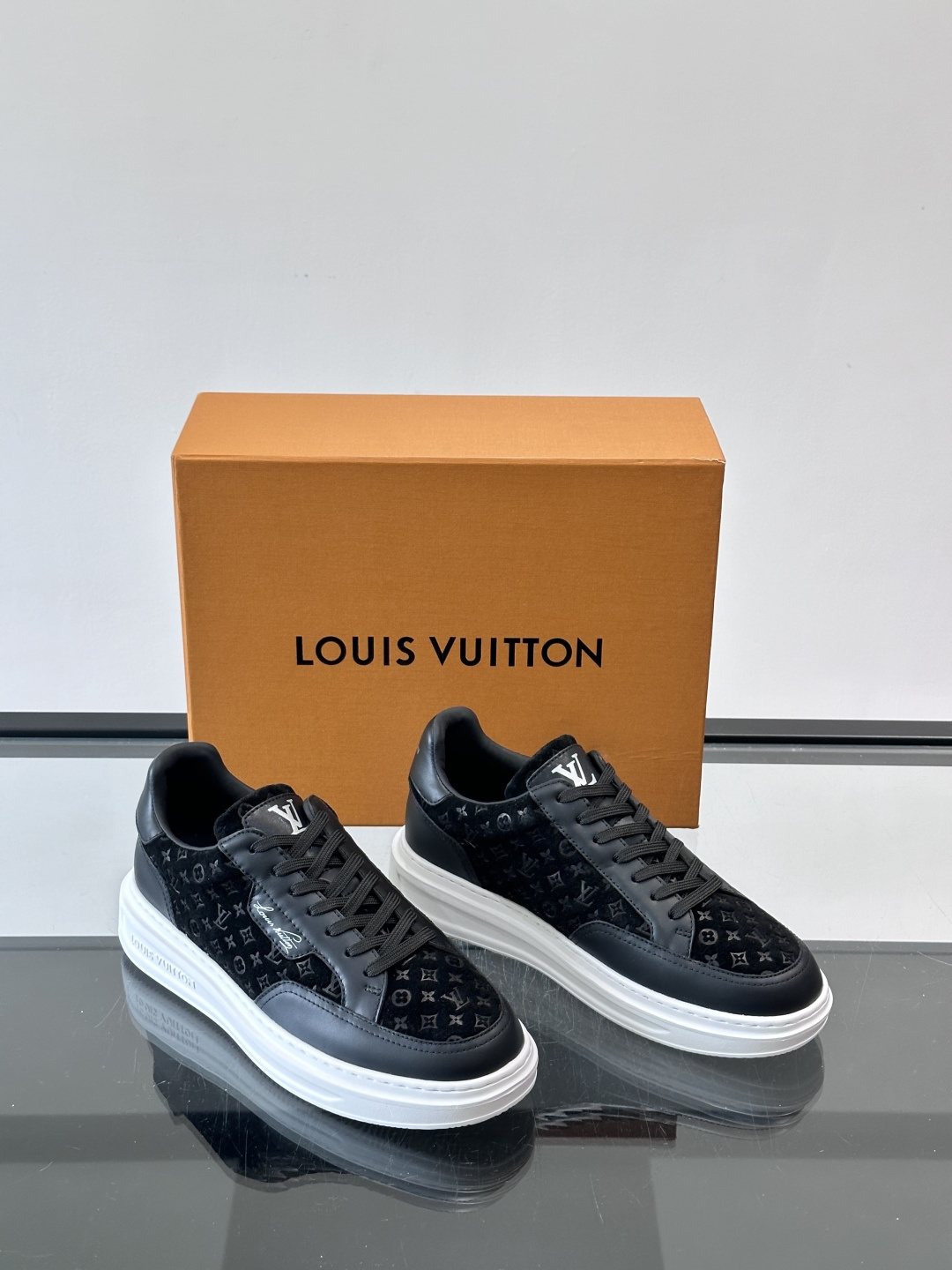 Louis Vuitton Embossed Low-Top Sneakers — front
