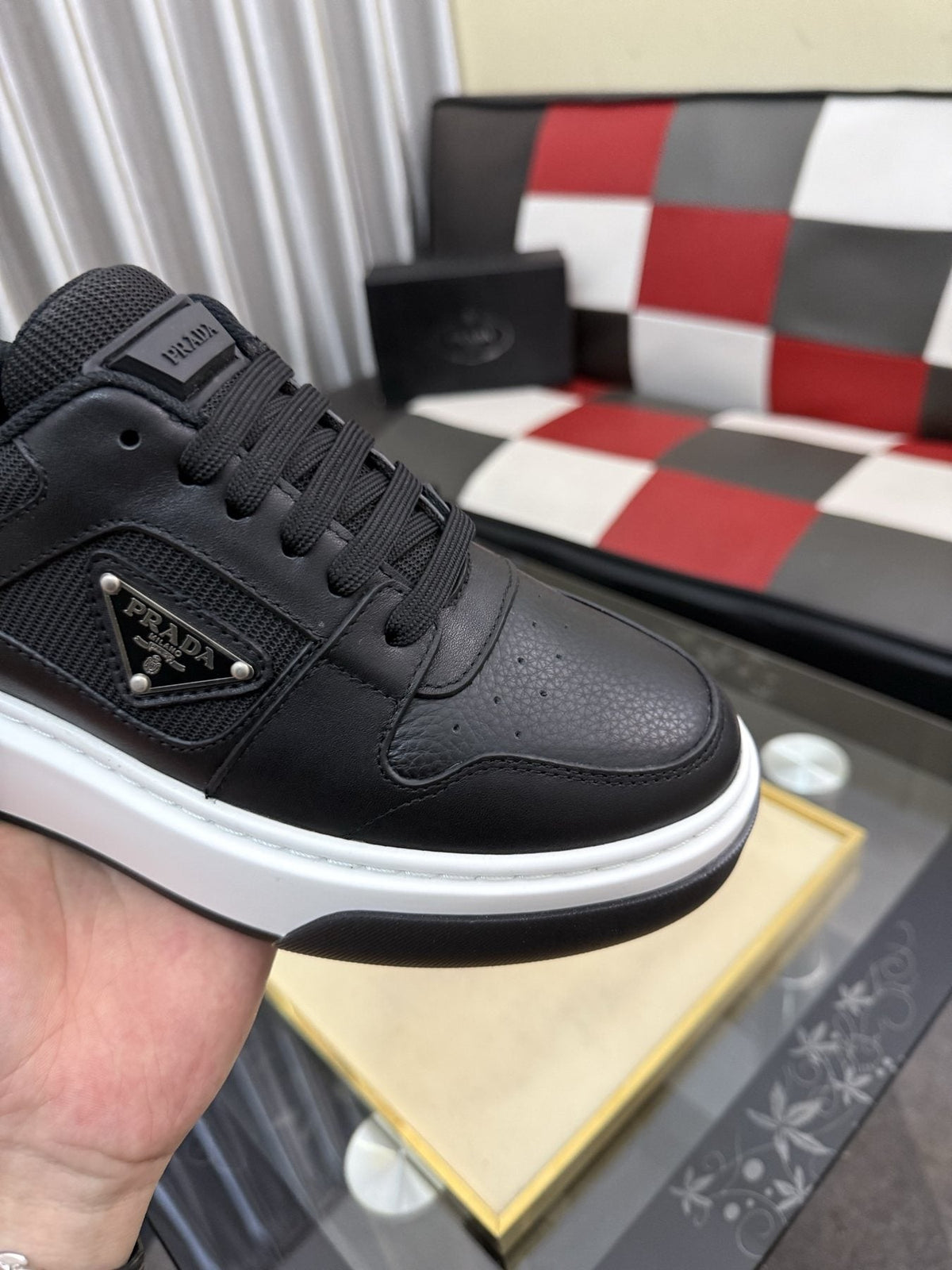 Prada Triangle Plaque Low-Top Sneakers — detail