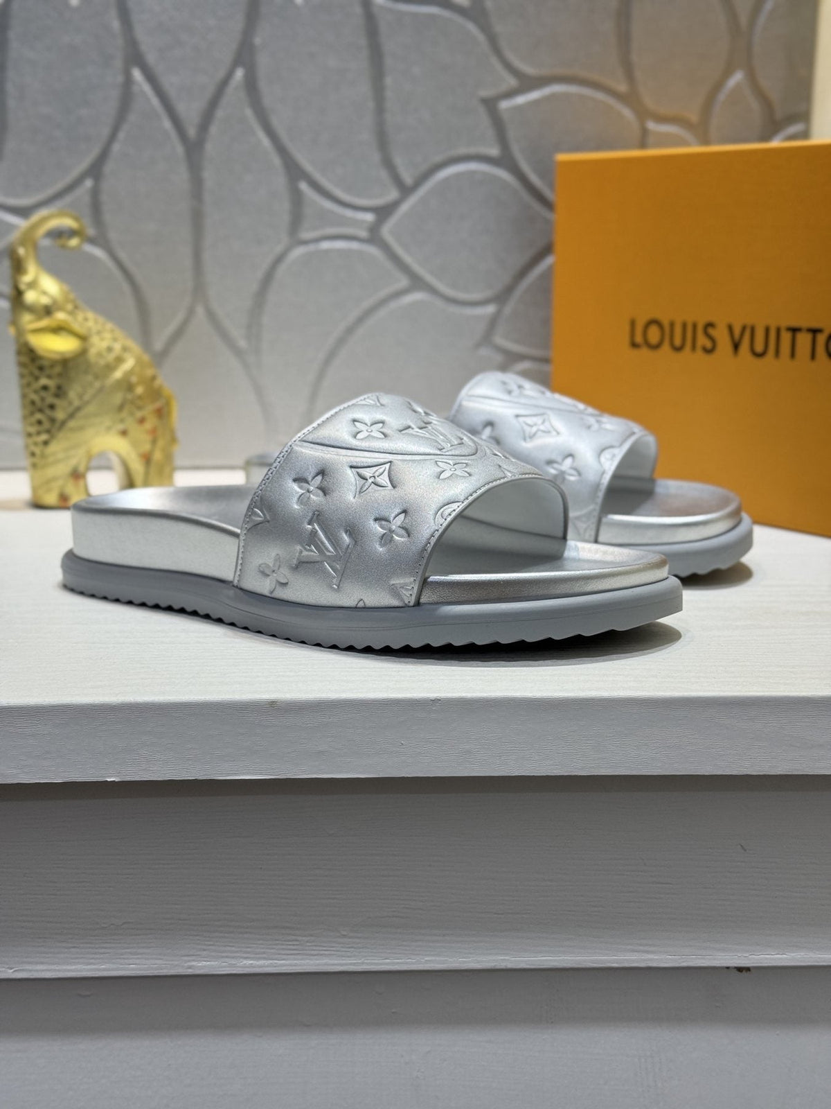 Louis Vuitton Embossed Slide Sandals — front